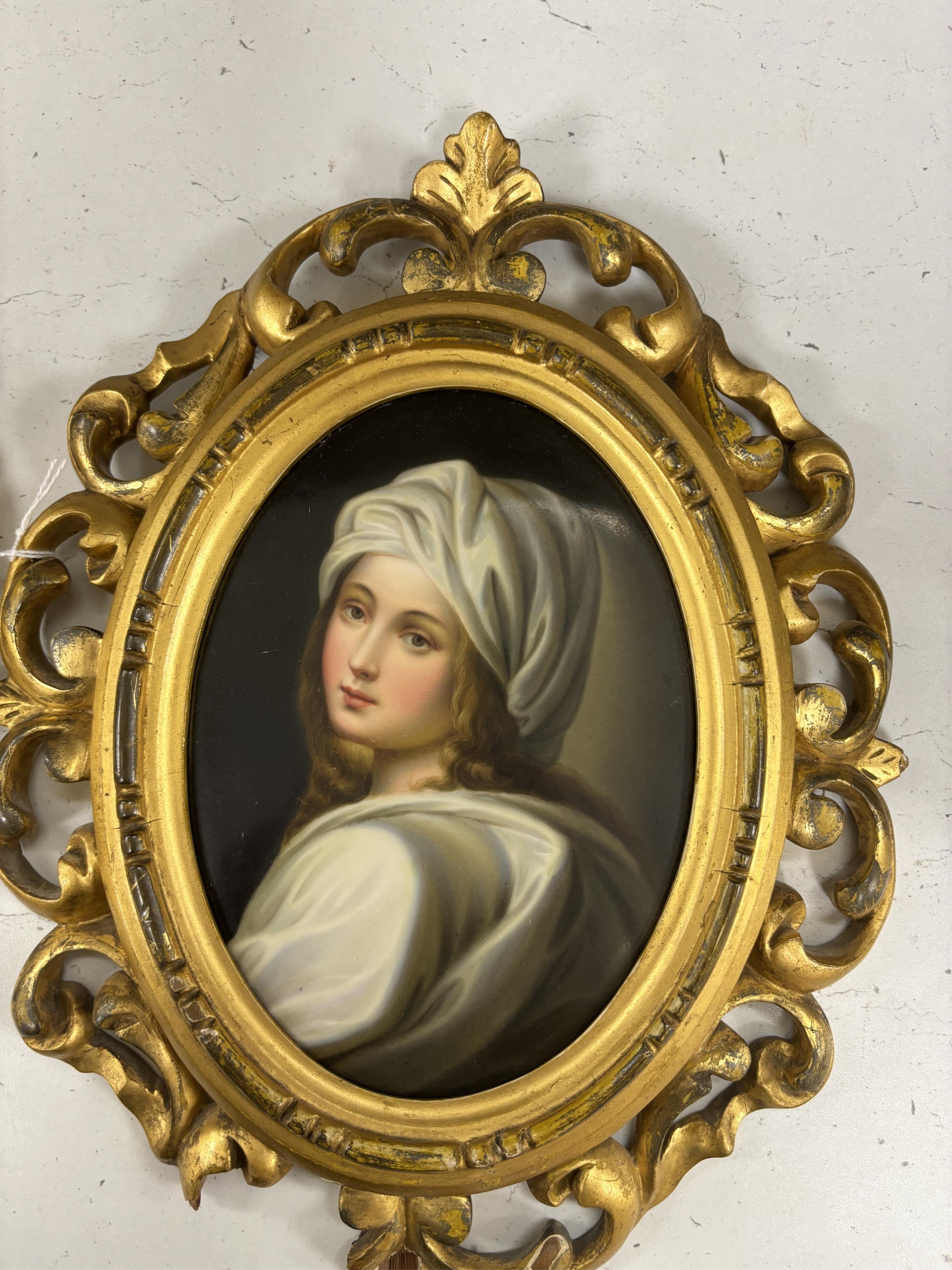 A pair of Continental oval porcelain plaques hand painted with female portraits, housed in Florentine giltwood frames (2)